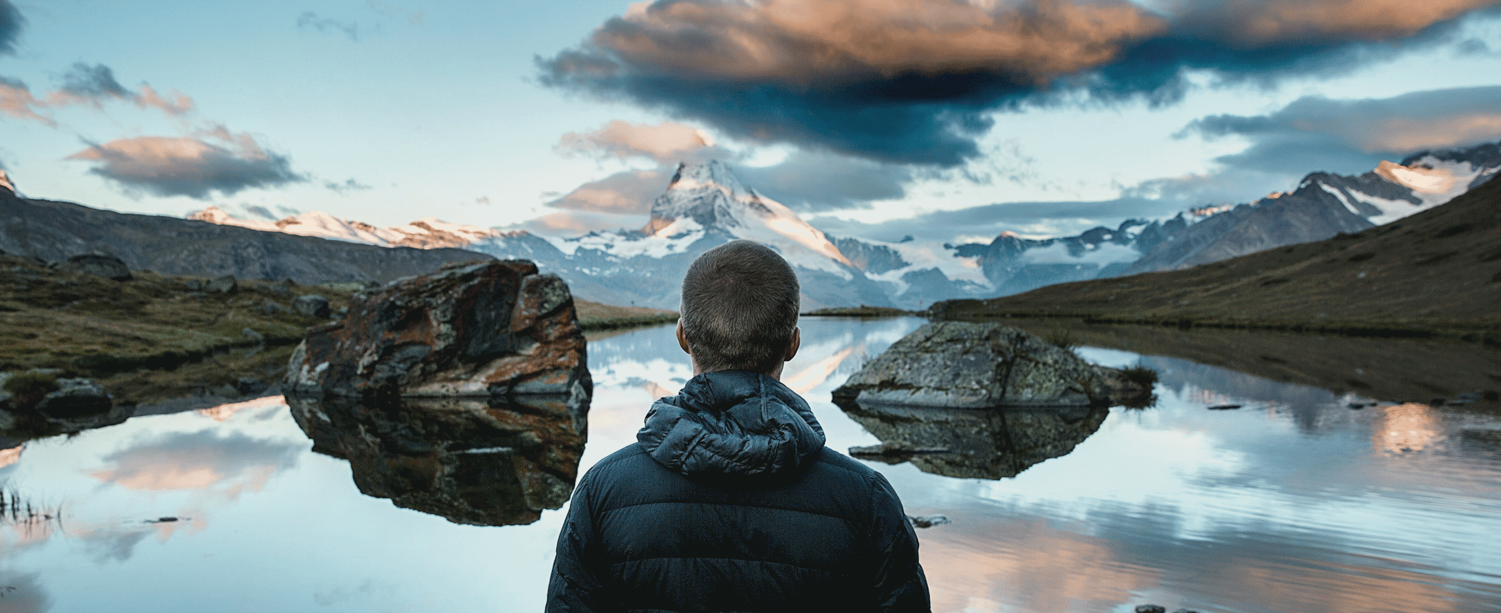 Photograph of a man by a lake